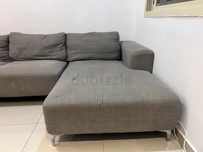 Grey L-shaped Fabric Sofa with Chaise — Good Condition. Home center sofa