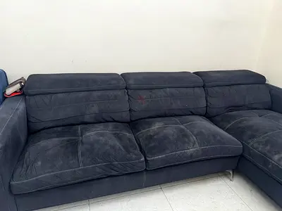 Used L-shaped dark grey suede sectional sofa - comfortable seating