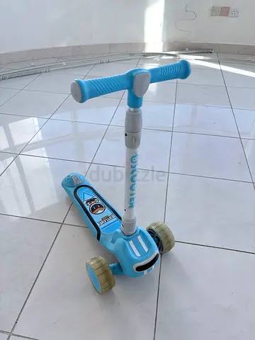 Light blue three-wheel kids scooter — good condition