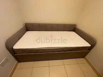 Grey upholstered single daybed with mattress (good condition)