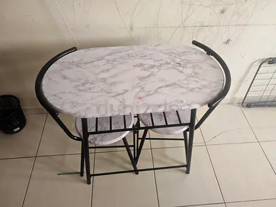 Compact marble-look folding dining table with two stools