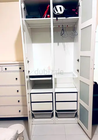 IKEA white two-door wardrobe with drawers and shelves