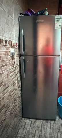Silver double-door refrigerator - good working condition