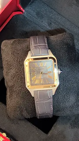 Santos-Dumont watch, large model, quartz movement. Steel case, 18K yellow gold (750/1000)