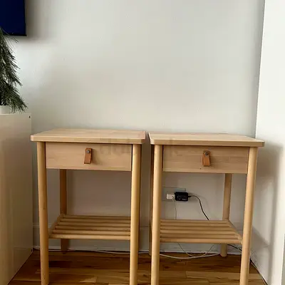 Pair of light wood bedside tables with shelf and drawer