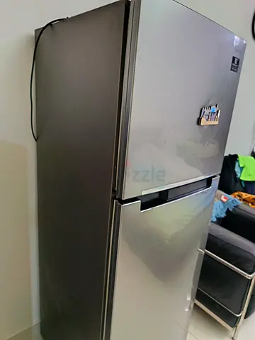 Silver double-door refrigerator - good condition