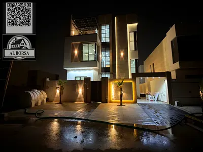 For sale a villa in Al Helio 2 in Ajman, 5 master bedrooms, a majlis, a hall, a maid's room, and a store