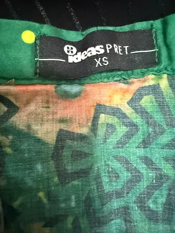 Green patterned womens top by HM divided label (size XS)