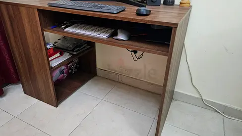Used wooden computer desk with keyboard tray and storage shelf