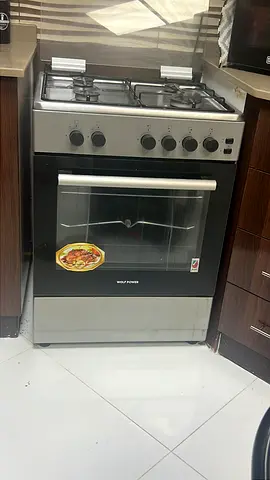 Silver freestanding gas cooker with oven — good working condition