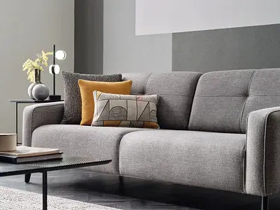 Deep and well tufted thick 3 seater fabric sofa