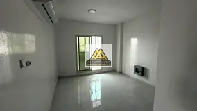 Two-bedroom apartment with a spacious living room and American design for rent in Al Rawda 2, Ajman,