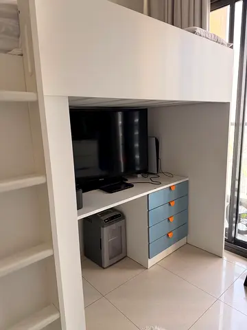 White bunk bed for kids with built-in wardrobe and open shelves