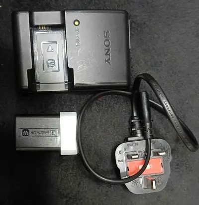 Sony camera battery charger with plug and adapter