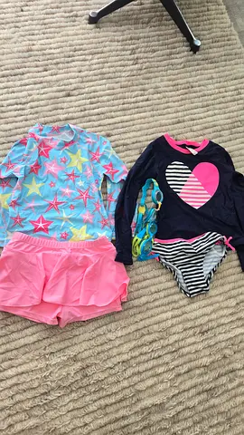 Two girls swimsuits - size small, good used condition. Between age 8 and 10