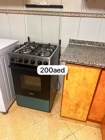 Used Midea 4-Burner Gas Cooker with Oven - Good Working Condition urgently sale . Moving