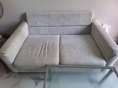 Light grey 2-seater sofa in good condition
