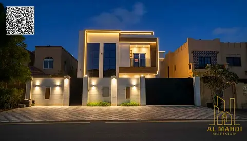 Two-story villa for sale in Al Muwaihat 1 area - Modern design - Full stone facade - Close to Sheik