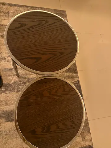 Pair of round wooden-top side tables with metal frame