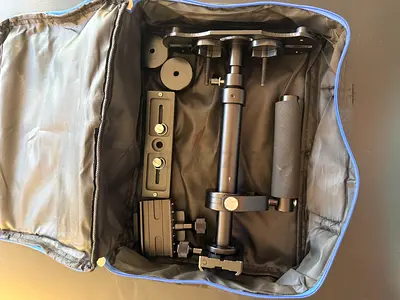 Compact camera stabilizer/shoulder rig with mounting plates and counterweights - used