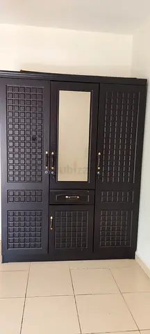 Malaysian wood cupboard 3 doors 1 drawer and one small door