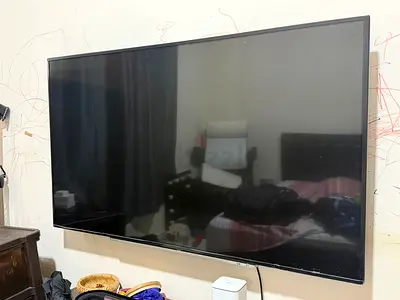 55-inch LED Smart TV (wall-mounted) - Good condition