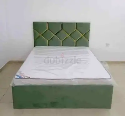 Green upholstered double bed frame with headboard - good condition