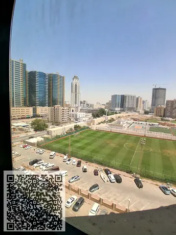 Two-bedroom apartment with a living room for annual rent in Al Rashidiya Towers, opposite Nesto Market. Spacious area with an open view of the stadium.