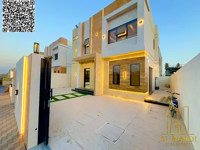 Price includes registration and ownership fees. Villa for sale in Ajman, modern design with a stone