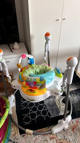 Baby Jumper/Activity Saucer with Toys - Good Condition