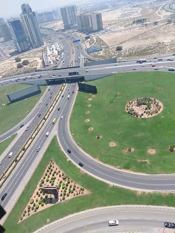 For rent in Al Taawun Sharjah spacious two bedroom hall with master room 3 bathrooms 3 balconies built in wardrobes free gym pool parking and 10 free