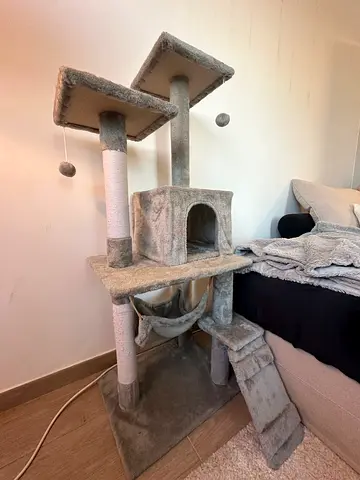 Used multi-level beige cat tree with scratching posts and hammock