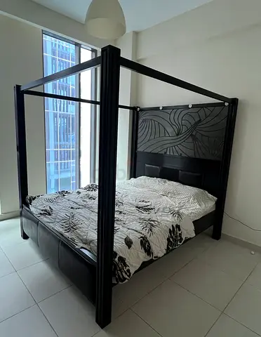 Solid Dark Wood Four-Poster King Bed with Decorative Headboard