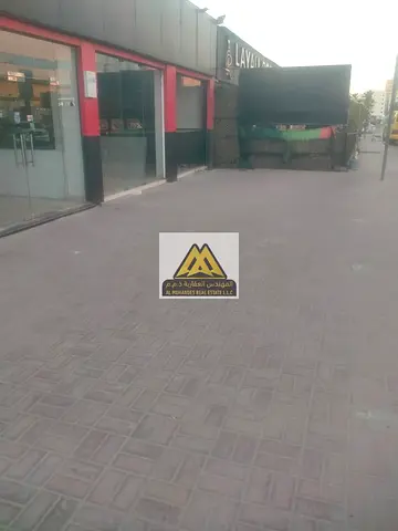 Commercial Shop for Rent in Al Rashidiya 1 Ajman – Large Space with Three Frontages and Prime Busy Location