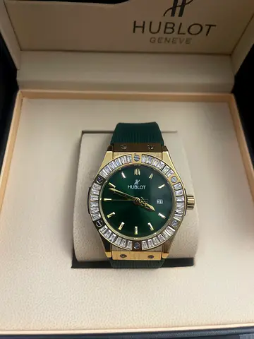 Hublot-style gold men’s watch with green dial and crystal bezel (preowned)