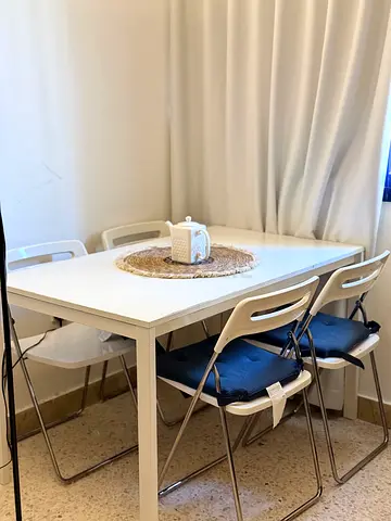 White Dining Table with 4 Folding Chairs