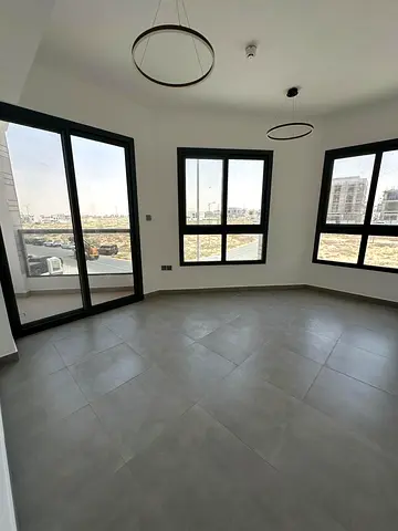 Luxury two-bedroom apartment with a living room, brand new, in Tilal Al Taawun City, Sharjah, available for annual rent. Features include central air