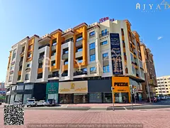 For annual rent: spacious two-level shop (ground + mezzanine) in Al Mowaihat 3 Ajman, Academy Street