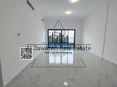 Two bedrooms and a living room, overlooking Khalifa Street, spacious areas, distinctive tower.
