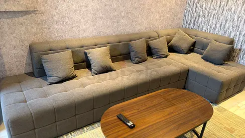 Large L-shaped Grey Fabric Sofa with Cushions - Good Condition