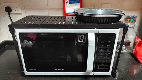 Samsung countertop microwave oven - good working condition. Along with items displayed in the photog