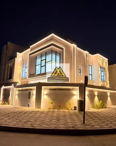 Corner villa for sale in Al Helio 2, Ajman, with a spacious building area and five bedrooms, includ