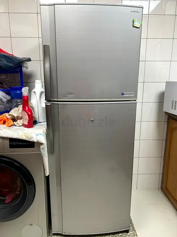 Silver double-door refrigerator (top freezer) - good working condition