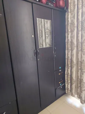 Dark wood 3-door wardrobe with mirror and drawers - used