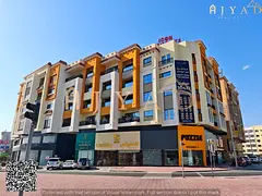 For annual rent: large shop with mezzanine in Al Mowaihat 3 Ajman, Academy Street, prime commercial
