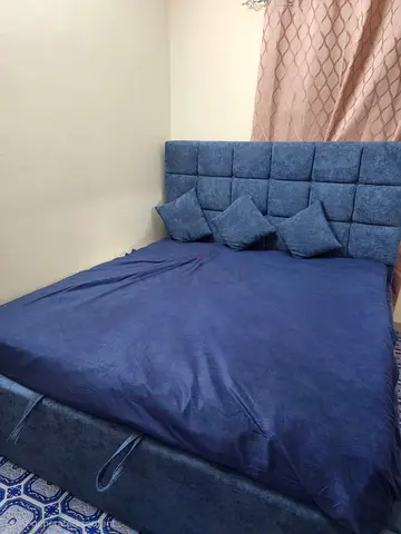 Blue Upholstered King Bed with Padded Headboard and Storage Base Warranty