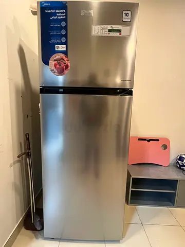 Silver two-door refrigerator in good condition