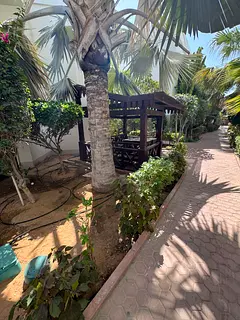 Two bedrooms, a large living room, and a spacious hall in Sharjah, with a garden and kids' play 