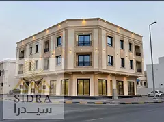 For sale: a residential and commercial building in Al Liwara, corner location on two streets.