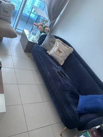 2 Dark blue velvet 2-3 seater sofa in good condition. And 2 side tables with saloon center table.